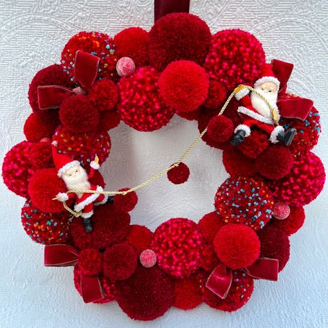 Two elfen Santa figures hanging on a mini pom garland nestled in a mass of red pompoms. Peppered with vintage velvet bows and berries. This wreath measures 16 inches. Sure to make anyone smile! Jingle Bell Crafts, Vintage Ornament Wreath, Red Pom Poms, Crochet Christmas Ornaments Free, Mini Pom, Pom Pom Wreath, Velvet Bows, Christmas Crafts For Kids To Make, Pom Garland