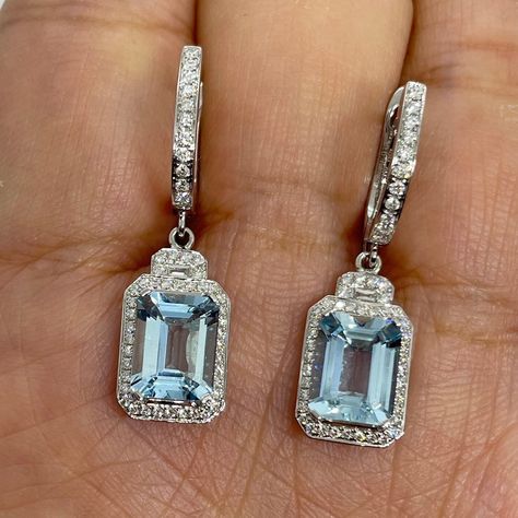 Beautiful aquamarine and diamond earrings white gold.  Excellent craftsmanship.  The diamonds are white and very sparkling!  The aquamarine is gem quality and has a lot of life to it.  It's color is blue not pale and washed out color.  The halo setting is very pretty design, the backings snap tight for secure fit on the ear.  These earrings will go with any outfit.  Very sparkling earrings, good size, dangles beautifully.  Aquamarines measures about 9x7mm.   Genuine aquamarine emerald cuts 3.80 carats total weight  Clarity: VS Eye clean stones  Natural round brilliant cut diamonds  Total weight: 0.59 Carats Clarity: SI Color: F Solid 18K White Gold 4.01 grams  Comes with gift box  * We have been in the wholesale Jewelry business for over 30 years serving the community at the same location. Diamond Dangling Earrings, Earrings White Gold, Pretty Accessories, Aquamarine Earrings, Halo Setting, Garnet Earrings, Silver Jewelry Fashion, Fancy Jewelry, Earrings White