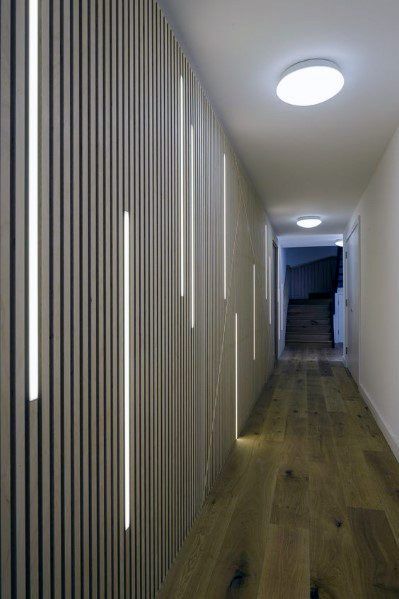 Another example of wood paneling with LED strip lights. In a hallway, that's pretty interesting I think. Blitz Design, Interior Light Fixtures, Corridor Design, Corridor Lighting, Wall Lamps Living Room, Led Light Design, Industrial Living, Industrial Livingroom, Long Hallway