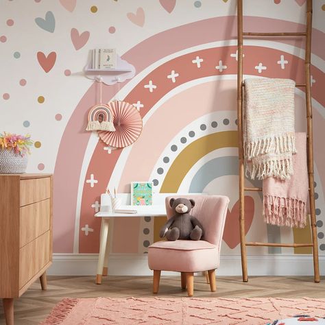 Let your little one chase the rainbow daily with this magical rainbow wall mural. This lovely mural will turn any plain wall into a picture of joy that will have your child's imagination reaching for the skies. A rainbow stretches across the entire wall, painted in shades of pastel pink, mustard yellow, and mineral blue. The colours are dreamy and soothing, creating a calming atmosphere that will help your child drift off into the sweetest dreams. The white space around the rainbow is filled with playful polka dots and hearts, adding a touch of fun. Each dot and heart matches the colours of the rainbow, creating a harmonious scene that will fill the room with joy. Whether you're decorating a nursery, a playroom, or your little one's bedroom, this wall mural is a show-stopper. The rainbow w Girls Rainbow Bedroom Ideas, Pastel Rainbow Bedroom, Rainbow Bedroom Ideas Kids, Shades Of Pastel Pink, Rainbow Wall Mural, Rainbow Mural, Shades Of Pastel, Rainbow Bedroom, Sweetest Dreams