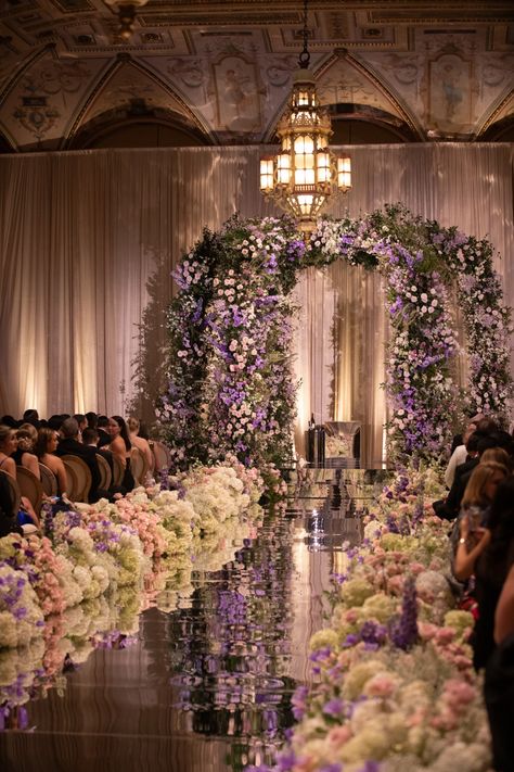 We wanted to ceremony to feel like a wildflower garden fairytale. The soft pinks, blues, purple and yellow wildflowers led up to our elevated chuppah. We saved the dreamy romantic white designs for the wedding reception which made for a dramatic change in tone. When Alex and I first had our room reveal for the reception, we were speechless: the hydrangea clouds, eclectic tablescapes and thousands of candles filled the room with romance and warmth Purple Romantic Wedding, White And Purple Wedding Flowers, Fairytale Garden Wedding, Purple Themed Wedding, Lilac Wedding Themes, Pie Wedding, Chuppah Ideas, Luxury Wedding Ideas, Rapunzel Wedding