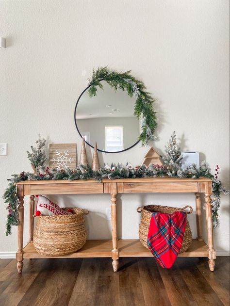 Embrace the serene beauty of Scandinavian Christmas decor with this minimalist entryway setup. A simple Christmas tree with white and natural wood ornaments, a soft white fur throw on the sofa, and a sleek candle arrangement on the coffee table bring a cozy yet clean look of a modern Scandinavian-inspired Christmas.Home décor, Home décor pieces
Home décor accents
Home décor aesthetics
Home décor ideas small
Home décor ideas living room
Home décor unique
Home décor ideas beautiful
Home décor them Entry Table Garland, Everett Foyer Table Christmas, Garland On Entry Table, Christmas Entry Way Ideas, Round Mirror Christmas Decor, Christmas Decor Ideas Console Table, Entry Way Table Christmas Decor, Entry Table Christmas Decor Ideas, Christmas Entryway Table