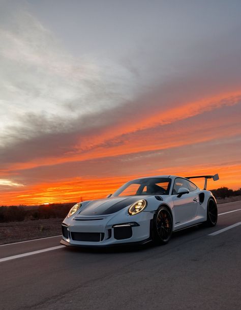 A white Porsche 911 GT3 RS parked on a road with a stunning sunset in the background. Porsche 911gt3rs, Visualization Manifestation, Fiery Sunset, Car Dream, Western Wallpaper Iphone, Ferdinand Porsche, Porsche Gt3, Car Wallpaper, Ferrari F40