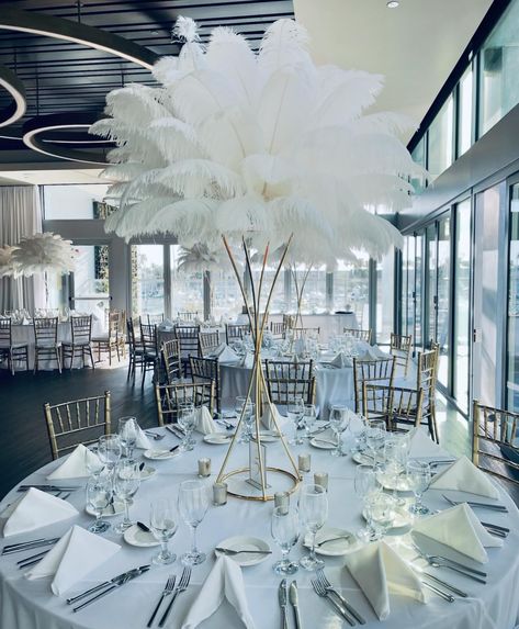 Dreamy evenings adorned with cascading white ostrich feather centerpieces ✨ Creating memories one elegant detail at a time • • • #laeventplanner #weddingdecor #weddinginspiration #weddinglosangeles #tablestyling #tablescape #tablecenterpiece #ostrichfeathers #ostrichfeathercenterpieces #feathercenterpiece #specialeventrentals #rentfeathers Feather And Flower Wedding Centerpieces, White Feather Wedding Decor, White Feather Centerpieces Wedding, Ostrich Feather Centerpieces Wedding, Feather And Pearl Centerpieces, Black Feather Centerpieces, Feather Decor Wedding, Feather Centrepiece, Ostrich Feather Decor