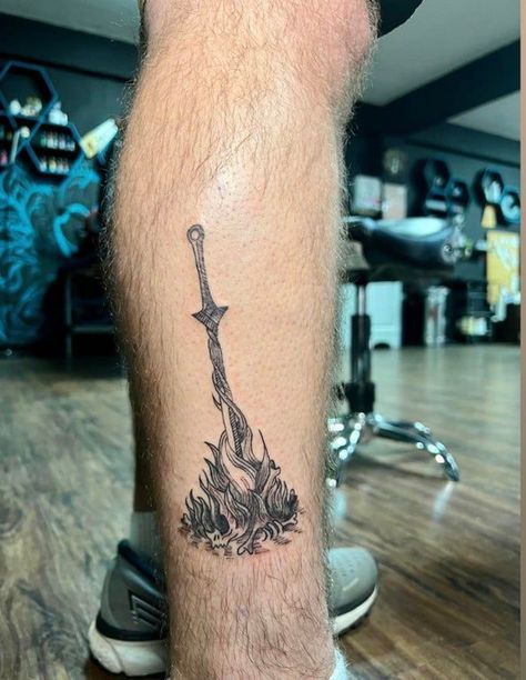 Soulsborne Tattoo, Small Bloodborne Tattoo, Dark Souls Inspired Tattoo, Dark Souls 3 Tattoo, Bloodborne Moon Presence Tattoo, Bonfire Tattoo, Dark Souls Tattoo Ideas, Bloodborne Tattoo, Dark Souls Bonfire Tattoo