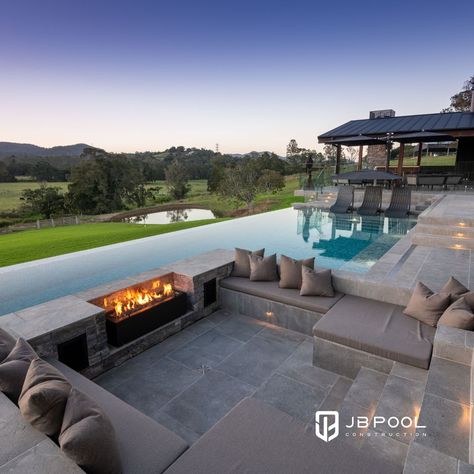 Which do you like best? Sunken fire pit? Raised fire lantern? One way to ensure year-round enjoyment of your swimming pool is to incorporate a fire or flame feature in the design.🔥 #OutdoorLifestyle #GoldCoastHomes #FireFeature Fire Pit Near Pool, Sunken Fire Pit, Raised Pools, Tamborine Mountain, Sunken Fire Pits, Pool Inspiration, Swimming Pool Landscaping, Mini Pool, Fire Pit Seating