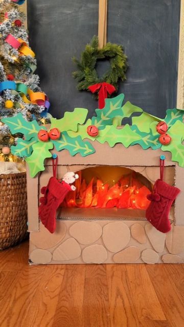 Studio Rosie on Instagram: "Cardboard Box Fireplace with Makedo 🎅 I used our @makedo tools to turn a cardboard box into a mantle, transforming our pizza oven into a cozy fireplace! The Makedo scrus are the perfect place to hang the stockings 😊 I love this Christmas update for our pizza oven. Rosie and Mae really love playing Santa and filling the stocking with surprises! Visit make.do/studiorosie10 (🔗 in bio) and use promo code STUDIOROSIE10 at checkout to get 10% off your order! #mymakedo #recycleandplay #recyclemeplay #craftcreateandmake #easycrafts #invitationtocreate #invitationtoplay #funbudgetplay #kidcrafts #toddlerplayideas #cardboardcrafts #christmascrafts #diychristmas #christmasactivities #festiveplayalltheway" Cardboard Box Fireplace, Box Fireplace, Empty Fireplace Ideas, Santa's Grotto, Cardboard Fireplace, Holiday Photoshoot, Make Do, Diy Fireplace, Christmas Fireplace