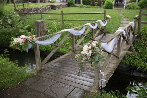 Lovely white tulle with beautiful bouquets of fresh flowers gracefully drapes the bridge at The Inn at Millrace Pond. Designed by Bilancia Designs for Renee & Rajeev's wedding/Lauren Dehrone Photography Bridge Decorations Ideas, Bridge Wedding Ceremony, Riverside Wedding Decorations, Bridge Flowers Wedding, Wedding On A Bridge, Wedding Pond Decorations, Decorating A Bridge For A Wedding, Outdoor Wedding Railing Decor, Outdoor Pond Wedding Ceremony