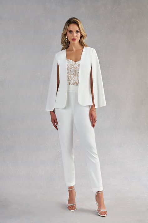 Surprise your guests with how modern you are by wearing our three-piece bridal pant suit, Tiffany. This style is made from stretch crepe, lace, and stretch satin. Her jacket is stylized with a cape instead of sleeves, the pants are high-waisted while the sweetheart bustier is drop-waisted to give a contoured look. The ankle length pants are a play on the tuxedo pant with a cummerbund waistband. Wedding Pantsuit The Bride, Bridal Pant, Modern Elegant Wedding Dress, Women Wedding Suit, Lesbian Wedding Outfits, Bridal Pant Suit, Wedding Suit Women, Wedding Suits For Bride, Jumpsuit Modern