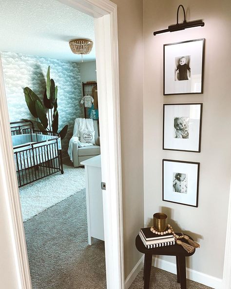 Light Above Photo Wall, Hallway Wall Decor Narrow, Upstairs End Of Hallway Ideas, How To Decorate Small Hallway Wall, End Hallway Wall Decor, Narrow Photo Wall, Lighted Photo Wall, Gallery Wall With Light Switch, Light Over Photo Wall