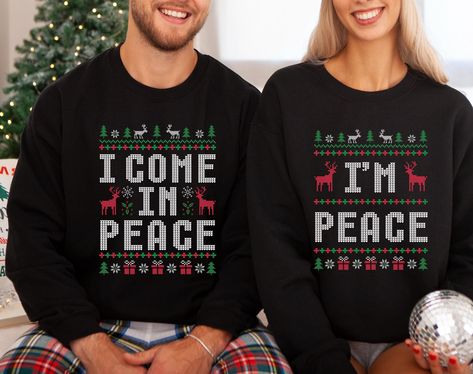 **Price is per sweatshirt** Brighten up your holiday season with the "I Come in Peace" and "I'm Peace"  Ugly Christmas Sweater." This hilarious couple sweatshirt is the perfect gift for him or her, combining comfort and humor that everyone will love. Our sweatshirts are super soft and made to order especially for you. Please check our color and size charts before you place your order. If you have any questions please message us; we'll gladly help. 👕 Gildan Sweatshirts: -Loose Fit -Runs true to size -50% cotton, 50% polyester 🇺🇲All of our products are Printed and Shipped in the USA 👕 Care Instructions: -Wash inside out, in cold water, on a gentle cycle. -Tumble dry low or let air dry -Do not use Bleach -Do not dry-clean -Do not iron on the design 👕 Size: Please take a look at the size Matching Ugly Christmas Sweaters, Couples Christmas Sweaters, Ugly Christmas Sweater Couples, Santas Favorite Ho, Bride Sweatshirt, Couple Christmas, Funny Couple, Ugly Christmas Sweaters, Ugly Christmas Sweater Funny