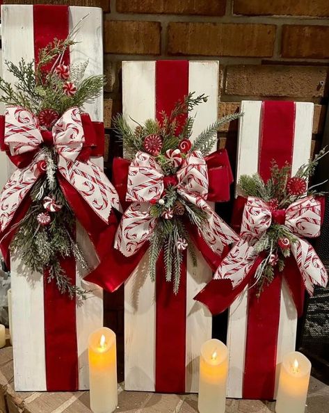 This candy cane Christmas present  decorative wood plank trio adds vintage farmhouse charm to your holiday decor not only for this holiday season but is built to last for many years to come!  The wooden gift set is ideal for your porch, foyer, front door decor, fireplace hearth, around the tree or anywhere you want to bring unique holiday cheer.  The candy cane 3 piece set pictured is ready for a new home with free shipping being offered now until December 4th** This set measures 30"H x 7 1/4" W Outside Candy Cane Decorations, 2 X 4 Christmas Crafts, Candy Cane Decorations Diy, Rustic Christmas Front Porch, Foyer Front Door, Wooden Christmas Presents, Wooden Presents, Wood Presents, Wood Christmas Decor