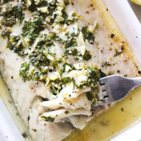 The Best Baked Corvina Recipe | Baked corvina is an elegant seafood dish that's easy to make in only 20 minutes. The tender and flaky fish is coated with a delicious garlic, lemon, and herb melted butter, then briefly roasted for a restaurant-quality meal right at home. - The Top Meal Corvina Recipes, Corvina Fish Recipes, Sea Bass Recipes, Fish Marinade, White Fish Recipes, Baked Fish Recipes, Fish Recipes Healthy, Savory Dishes, Fish Recipe