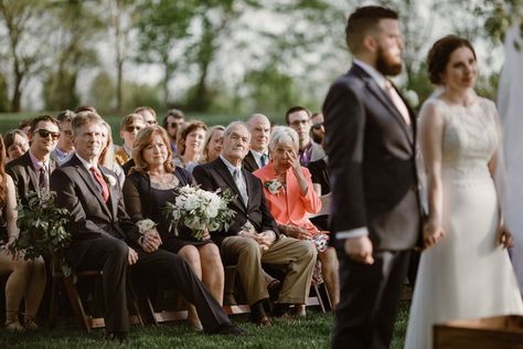 A couple is shown in the foreground during their wedding ceremony as their guests look on, and an elderly woman in a pink suit in the front row wipes away tears in a photo by Betty Clicker Wedding Ceremony Pictures, Wedding Ceremony Ideas, Portrait Shoot, Outdoor Wedding Photography, Elderly Woman, Wedding Ceremony Photos, Practical Wedding, Wedding Picture Poses, Wedding Photography Styles