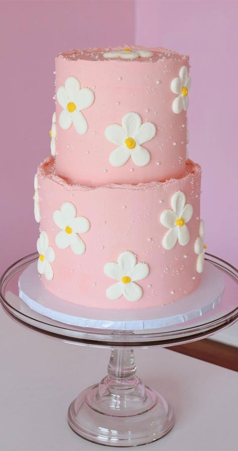 daisy pink cake, first birthday cake, summer-themed cake, summer theme cake, birthday cake, summer vibe cake, colorful cake, colourful cake ideas, tropical vibe cake, cherry cake Two Tier Groovy Cake, Flower Cake First Birthday, Groovy Smash Cake Ideas, Simple Second Birthday Cake, Cake Summer Theme, Colourful Cake Ideas, Daisy Cake Ideas Simple, Birthday Cake For 2 Year Girl, Summer Theme Cake