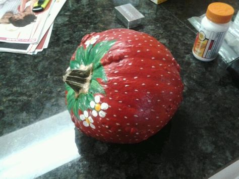 Pumpkin painted like a strawberry! Strawberry Pumpkin Decorating, Watermelon Pumpkin Painting, Strawberry Painted Pumpkin, Fruit Pumpkin Painting Ideas, Strawberry Shortcake Pumpkin Painting, Food Themed Pumpkin Decorating, Cheetah Pumpkin Painting, Pumpkin Painting Ideas Coquette, Pumpkin Decorating No Carving