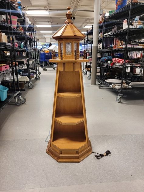 Check this out Captain Ahab! It's a bona-fide light-up all solid wood light house shelf! Wow! It's heavy and like 4 feet tall! We get the coolest donations! 😀 https://bit.ly/OVGWLocations #GoodwillFinds #LightHouse #Shelf #HomeDecor #Furnishing #Marine #sea #MobyDick Wooden Lighthouse Plans How To Build, Light House Shelf, Diy Lighthouse Outdoor Wood, Captain Ahab, Lighthouse Candle Holder Lanterns, Lighthouse Dollhouse, Diy Lighthouse, Wood Lighthouse, Marine Sea