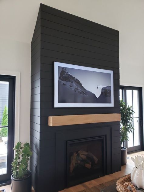 Black Vaulted Fireplace, Black Fireplace Statement Wall, Black Fireplace Between Windows, Charcoal Color Fireplace, Black Fireplace Floor To Ceiling, Black Tile And Shiplap Fireplace, Fireplace That Sticks Out From Wall, 8 Ft Fireplace, Brick Fireplace With Black Shiplap