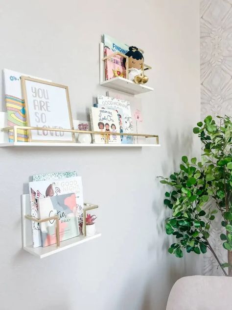 Cecelia's Nursery Reveal - Taryn Newton Acrylic Bookcase, Flower Floor Lamp, Kids Shelves, Baby Mattress, Flower Mirror, Gold Book, Modern End Tables, Nursery Storage, Pink Nursery