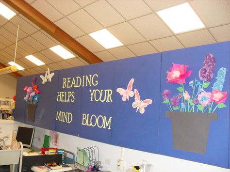 Library Display: Reading Helps Your Mind Bloom | librarian vs storytime Tissue Paper flowers!! Reading Helps Your Mind Bloom, Blooms Taxonomy Display, Our Class Is In Full Bloom Bulletin Board, Learn Grow Blossom Bulletin Board, Library Spring Displays, Imagination Blooms Here Bulletin Board, Reading Display, Reading Bulletin Boards, Reading Help