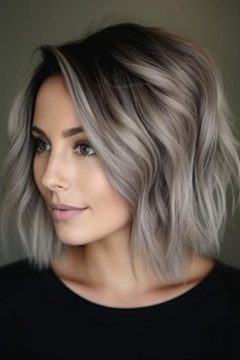 Ash blonde with bold black streaks is a dramatic and contemporary style. The black streaks create a stark contrast against the ash blonde base, offering a bold and unique look.  Click here to check out more trending ash blonde hair color ideas you need to try. Ash And Silver Hair, Blonde And Grey Balayage, Platinum Ash Blonde Hair Balayage, Cool Grey Hair Color, Ash Bob Hair, Platinum To Brown Before And After, Haircolour Ideas Short Hair, Ash Blonde Hair With Dark Lowlights, Sorry Blonde Hair