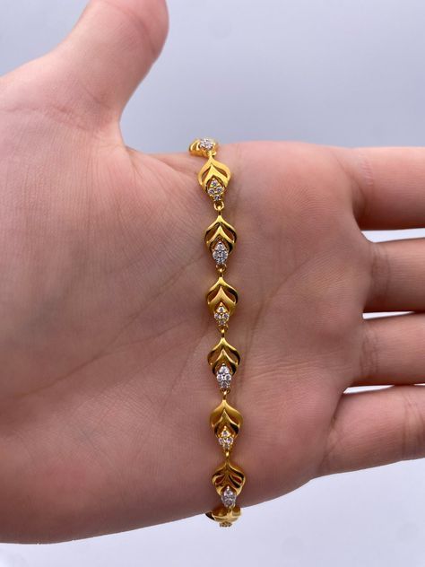 A Beautiful & Dainty 22ct / 22K Yellow Gold & Cubic Zirconia (CZ) Fancy Bracelet Metal : 22K Gold 916 Gold Weight : 9.2 GramsLength : 7 inch Width : 6.0 mm Packaging : Elegant Box Shipping Free in UK Shipping World Wide : See Policy Payment : PayPal, Credit Card, Bank Transfer Returns Policy : 14 Days Hassle Free Returns for 100% Refund To try this item Or View More from our collections Please Visit Our Showroom at North west London . Bracelets Gold Design For Women, Gold Bracelets Design For Women, Gold Bracelet Simple Design, Good Bracelets For Women, Elegant Gold Bracelet Simple, Braslate Design For Women, Women Bracelets Gold Designs, Chain Bracelet Gold For Women, Bracelets Designs For Women