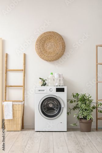 Stock Image: Modern washing machine with basket, houseplant and ladder near white wall. Interior of home laundry room Laundry Room Shoot Ideas, Laundry Asethic, Laundry Room Ideas With Laundry Shoot, Modern Laundry Shoot, Laundry Room Sketch, Closet Laundry Room Organization, Modern Washing Machines, Laundry Room Lighting, Laundry Room Flooring