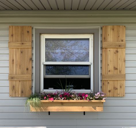 gorgeous cedar shutters/window box Mobile Home Window Shutters, Front Window Shutters, Small Window Shutters Exterior, Cedar Shutters On Vinyl Siding, Cedar Shutters And Window Boxes, Trailer Shutters Mobile Homes, Window Box With Shutters, Cedar Window Shutters, Wood Shutters On Vinyl Siding