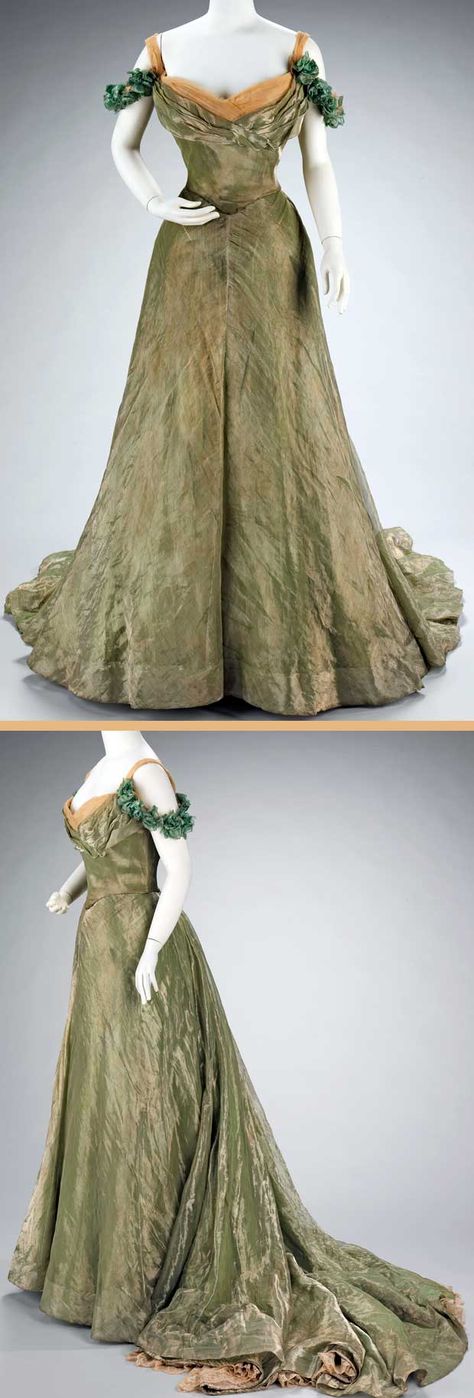 Ball gown, Jacques Doucet, 1898-1900. Silk and metal. Ball gown, Jacques Doucet, 1898-1900. Silk and metal. This ball gown is simple in design, yet extravagant by the choice of materials. The sheer overlayer is enhanced by the solid lamé underlayers and a sense of luxury is added by the hidden lace flounce at the hem. Metropolitan Museum of Art. Jacques Doucet, 1890s Fashion, 1800s Fashion, Fashion Through The Ages, Historical Dress, Historic Fashion, Old Dresses, Antique Dress, Victorian Clothing