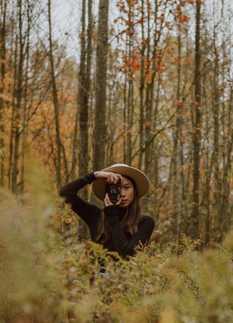 Stylish young Asian female photographer shooting autumn forest on vintage camera · Free Stock Photo Photographer With Camera, Photographic Film, Aesthetic Shop, Mountain Photography, Dream Wedding Ideas Dresses, Target Dresses, Target Style, Female Photographers, Autumn Forest