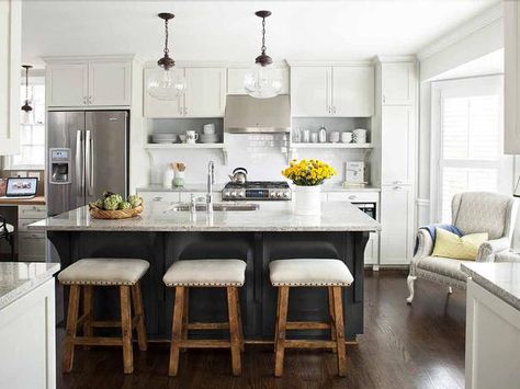 Work Hard, Play Hard - Home to the dishwasher, sink, trash and recycling bins, this glossy black island works hard for the family during the week then plays hard on special occasions — the 7-foot by 3-1/2-foot island offers plenty of serving space for entertaining. See more photos of this kitchen that was featured in HGTV Contrasting Kitchen Island, Espresso Furniture, Серая Кухня, Mobile Kitchen, Gray And White Kitchen, White Kitchen Island, Home Staging Tips, Kitchen Cabinets Decor, Kitchen Island With Seating