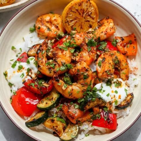 30 Minute Greek Shrimp Bowls - Dishing Out Health Healthy Grain Bowls, Shrimp Bowls, Greek Shrimp, Dishing Out Health, Shrimp Bowl, Mediterranean Recipes Healthy, Mediterranean Diet Recipes Dinners, Shrimp And Vegetables, Easy Mediterranean Diet