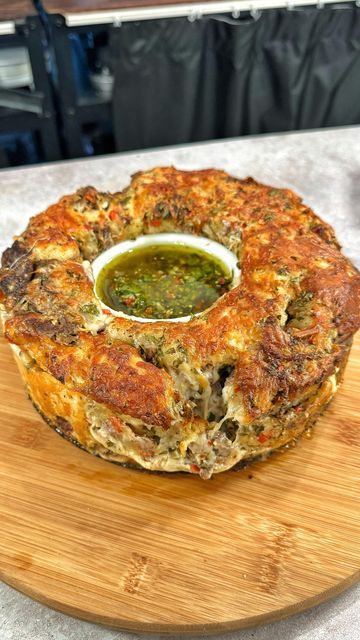 Josh Elkin on Instagram: "Pull Apart Steak and Chimichurri Bread Ingredients below (Makes 12 inch loaf) INGREDIENTS 16oz chopped pizza dough 1 1/2 cups of shredded ribeye 1 1/2 cups grated provolone 1 1/2 cups grated pepper jack CHIMICHURRI (save 1/2 cup for dipping) 2 cups chopped flat leaf parsley 1 cup chopped red chilis 1/2 cup red wine vinegar 1/4 cup chopped garlic 1/4 cup dried oregano 2 cups olive oil Season with salt and pepper" Pull Apart Steak And Chimichurri Bread, Steak And Chimichurri, Hawaii Bbq, Cheese Pull Apart, Bread Pull Apart, Josh Elkin, Chimichurri Steak, Pull Apart Pizza Bread, Bread Pull Apart Recipes