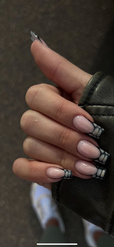 The french tip nail aka french manicure is getting a makeover in 2024. We got the latest viral nail designs that are trending all over tiktok and beyond. #nails #nail Follow us for the latest 2024 nail ideas and nail inspo! Black White Nails Designs Classy, Reptile French Tip Nails, Nails Inspiration Long Square, Classy Nails Winter, Black Croc Nails, Croc Nail Design, Square Winter Nails, Croc Nails, Snake Skin Nails