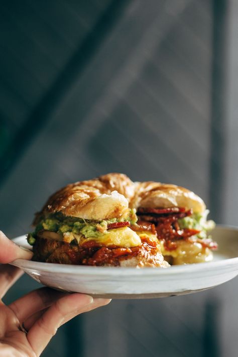 The Ultimate Breakfast Sandwich 😍😍😍 with eggs, bacon, guacamole, chunky tomato sauce, pepper jack cheese, all on a toasted croissant. Favorite ever. | pinchofyum.com Breakfast Sandwich Sauce, Chunky Tomato Sauce, Sandwich Sauce, Bacon Guacamole, Roast Beef Sandwich, Sandwich Sauces, Croissant Sandwich, Breakfast Sandwich Recipes, Ultimate Breakfast