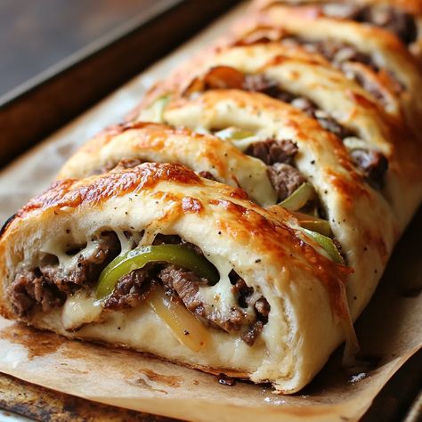 Philly Cheesesteak Stromboli Philly Cheese Steak Braid, Stromboli Philly Cheesesteak, Philly Cheese Steak Pinwheels, Philly Cheese Steak Puff Pastry, Cheesesteak Stromboli Recipe Easy, Mozzarella Cheesesteak Stromboli, Cheese Steak Stromboli Recipe, Recipes With Philly Steak Meat, Philly Stromboli