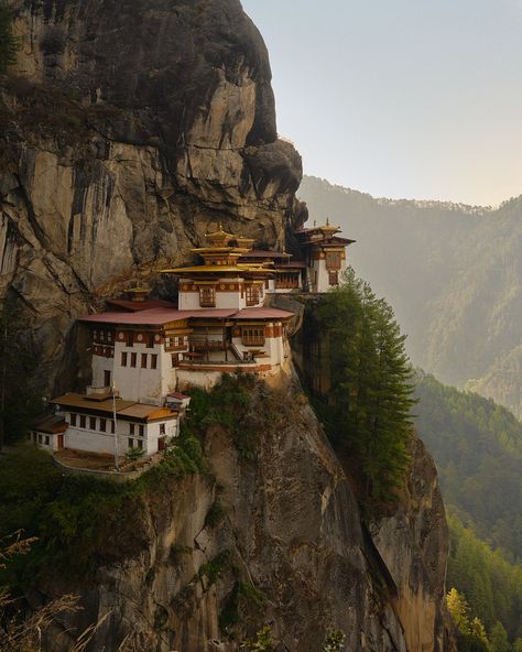 In a kingdom beyond the clouds, life moves to the beat of its own drum. This is the land of the Thunder Dragon, where prosperity is measured in happiness. The five lodges of Amankora make their home in the sweeping valleys and forested hills, where prayer flags flutter in the breeze and water trickles down from the surrounding Himalayas to form silent lakes. Bhutan Photography, Gross National Happiness, Thunder Dragon, Cliff Diving, Evergreen Forest, Happiness Project, Prayer Flags, Domestic Flights, Eco Friendly Travel