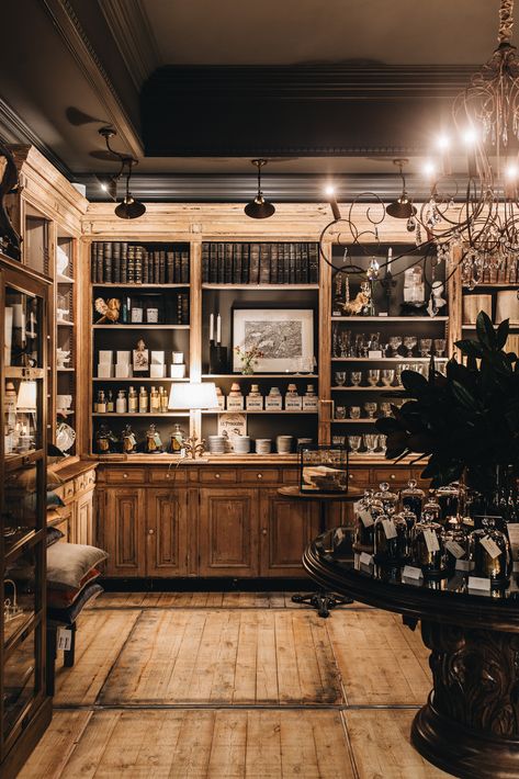 Old Leather Books in Antique Cabinetry by Suzie Anderson Home at Old Bank Atelier Moody Retail Store, Vintage Shop Aesthetic, Vintage Craft Room, Academia Interior, Dark Academia Interior, Cosy Reading Nook, Herbal Shop, Argyle Street, French Boutique