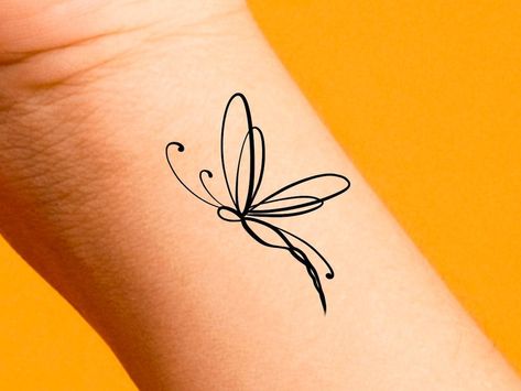 This Tattooing item by DaintyTattoo has 64 favorites from Etsy shoppers. Ships from Pittsburgh, PA. Listed on Jun 4, 2024 Small Dragonfly Tattoo, Tiny Wrist Tattoos, Animal Tattoo Ideas, Dragonfly Tattoo Design, Ear Tattoo Ideas, Tattoo Lettering Styles, Petit Tattoo, Tasteful Tattoos, Wrist Tattoos For Women