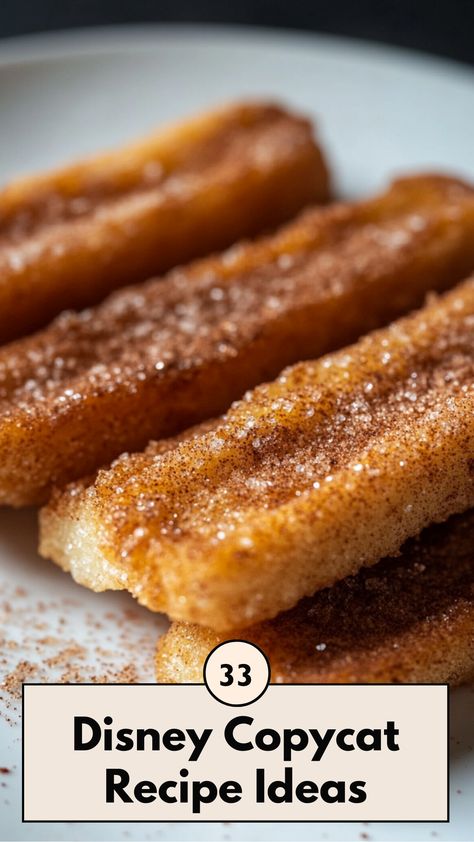 A close-up of a homemade Disney churro with cinnamon sugar, placed on a white plate, capturing the golden, crispy texture. Disney Park Recipes, Disney World Food Recipes, Disney Parks Recipes, Disneyland Copycat Recipes, Disney Themed Snacks, Disney World Recipes, Disney Copycat Recipes, Disney Dessert Recipes, Disneyland Recipes