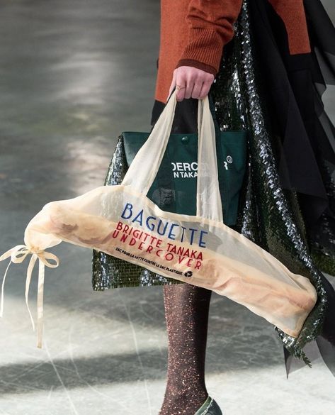 It's no longer about looking like a snack: it's all about carrying one.⁠ ⁠ Fashion designers must've been starved for inspiration this season because they ordered up a heaping helping of food-shaped handbags for Fall/Winter 2024.⁠ ⁠ Moschino and UNDERCOVER were truly in sync: the former carbed up with baguette-shaped clutches while the latter created totes large enough to carry a large loaf of French bread or a bread-shaped bag, at least.⁠ Over at LOEWE, the vibe was deliciously indulgent. Cr... Looking Like A Snack, Baguette Bread, Bakery Branding, Winter Bags, Bread Bags, In Sync, Fall Winter 2024, French Bread, Baguette Bag