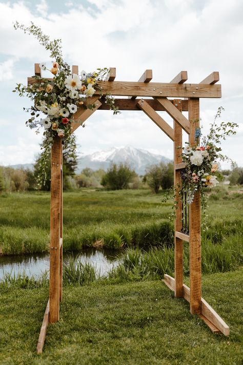 Boulder Blooms - Airy and Whispy Carbondale Valley Wedding Outdoor Arbor Wedding, Simple Arbour Flowers, Wood Archway Wedding, Elegant Wedding Arch Outdoor, Wooden Alter Wedding, Wedding Arbor Wildflowers, Wild Flower Wedding Arbor, Wooden Wedding Arbor, Diy Arch For Wedding