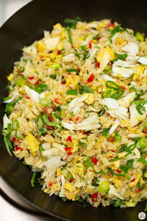 1 small onion, minced 3 garlic cloves, minced ½ cup minced red bell pepper 1 ½ cups cooked crab meat, divided 2 eggs, lightly beaten 3 cups rice, cold 1 tablespoon oyster sauce 2 tablespoons fish sauce Ground pepper, to taste 3 scallions, sliced thinly ¼ cup chopped cilantro Lime, optional Chinese Food Recipes Crab Meat, Crab Rice Recipe, Crab And Rice, Meat Fried Rice, Crab Fried Rice Recipe, Crab Recipes Easy, Crab Fried Rice, Crab Rice, Crab Fries