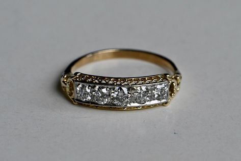 "A 14K yellow gold 1930s ring with a row of five of Old European Cut diamonds in an intricate mounting. The fretwork details are easy to admire from every angle and they elevate this ring from \"pretty\" to \"gorgeous.\" This ring wears and stacks like a band but the diamonds sparkle like a cocktail ring! The diamonds are flush-set in a 14K white gold head with milgrain details. They appear to float across the face of the ring! Exceptional in every way.  Note: This ring comes with a jewelry appr 1930s Wedding Ring, 1930s Ring, Art Deco Gold Diamond Ring Gift, Art Deco Engraved Diamond Ring, 1940s Ring, Art Deco Engagement Ring Vintage, Vintage Engagement Ring, Artdeco 1930s Wedding Ring, Vintage Wedding Rings 1920s