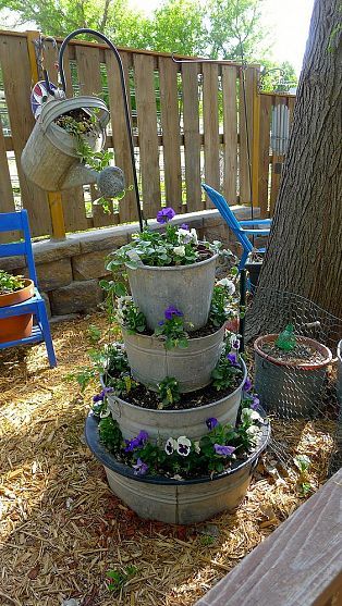 I like the wash tub idea, would be good especially if you have wash tubs &/or buckets in different sizes with the bottoms rusted out.... Bucket Planters, Flower Tower, Garden Containers, Diy Yard, Gardening Advice, Garden Yard Ideas, Garden Crafts, Lawn And Garden, Shade Garden