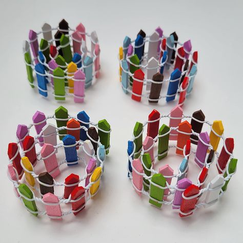 PRICES MAY VARY. 45-inch miniature fairy garden fence with rainbow-colored wooden pickets, sold as a four-pack of 11- to 12-inch sections (length varies slightly). Flexible fence can be bent into curves, corners, squares, circles - any shape you can imagine! Colorful pickets are arranged randomly for a whimsical touch to your fairy garden or dollhouse. Fairy Garden Fence, Rainbow Wood, Rainbow Fairies, Miniature Fairy Garden, Fairy Garden Diy, Outdoor Statues, Miniature Fairy, Ceiling Fan In Kitchen, Miniature Fairy Gardens