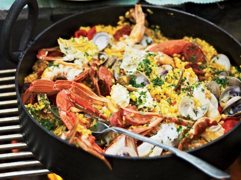 Easy Grilled Paella | To cook this delicious seafood-and-chorizo paella, chef Pete Evans uses his grill as both a stovetop and an oven, simultaneously using direct and indirect heat. Prawn Paella, Paella Recipes, Bbq Meals, Grilled Scallops, Grilled Seafood Recipes, Grilled Oysters, Grilled Lobster, Seafood Paella, Grilled Shrimp Recipes