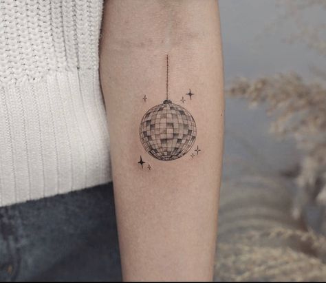 mirrorball tattoo on forearm Fineline Disco Ball Tattoo, Mirrorball Tattoo Design, Disco Ball Tattoo Simple, Mirrorball Tattoo Taylor Swift, Disco Tattoo, Mirrorball Tattoo, Disco Ball Tattoo, T Tattoo, Tattoos Leg