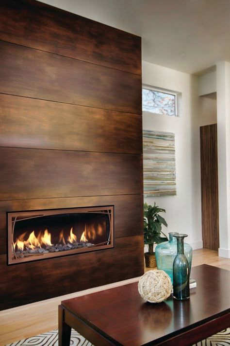 Light Tone Wood Floor With Modern Wood Fireplace Modern Fireplace Inserts, Fireplace With Metal Surround, Adhesive Fireplace Tile, Walnut Mantel Fireplace, Modern Drywall Fireplace, Entryway Fireplace Ideas, Metal Fireplace Wall, Casual Family Room Design, Small Space Fireplace Ideas