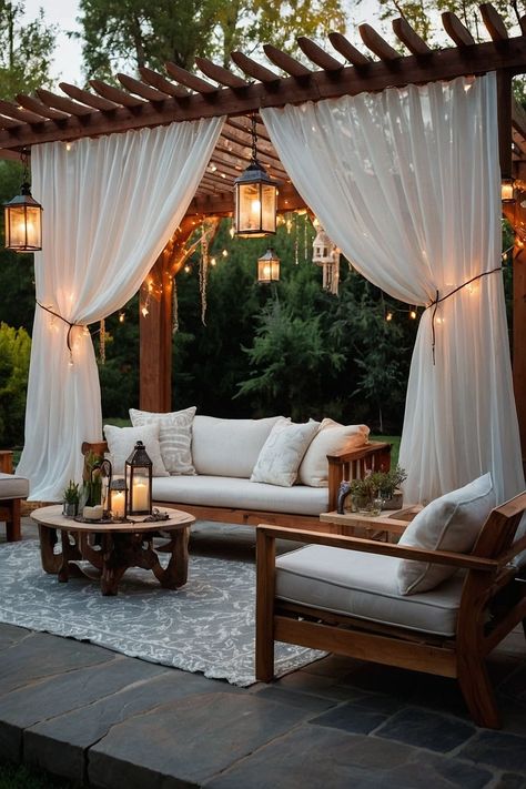 Design a dreamy patio with a pergola draped in sheer curtains and adorned with fairy lights. A perfect cozy retreat. Add timeless elegance to your space with classic balcony curtains Dubai, perfect for balconies that deserve grace. These classic designs beautifully combine functionality, offering shade while enhancing your outdoor decor with a hint of tradition.#BalconyCurtainsDubai #ClassicDesign #TerraceElegance #PatioStyle #OutdoorLuxury #BalconyMakeover #TimelessDecor #DubaiLiving Curtain Pergola, Cozy Pergola, Pergola With Curtains, Dreamy Patio, Patio For Entertaining, Patio Oasis Ideas, Zen Retreat, Steel Decor, Balcony Curtains